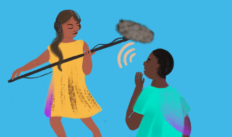 image of a woman holding a microphone next to a man who is listening